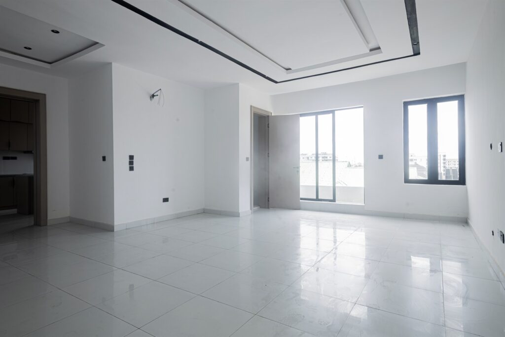 Brum Height 4: Bright living room beside glazed balcony doors